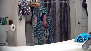 Black hottie: Undressing for shower