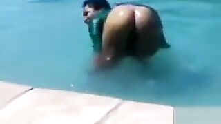 Ebony babes swimming and pissing in the pool
