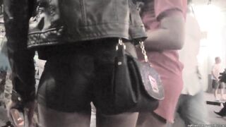 Candid Black butt in leather shorts