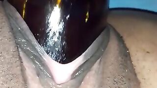 Large snatch black banging and poking out bottle from vagina
