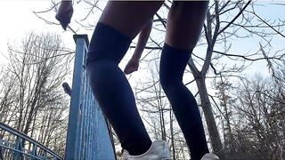 Excited Black shakes butt and shows her holes in forest near public bridge