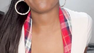 Black schoolgirl sucking a sex-toy shows off body and disrobes, then spits on feet and breasts