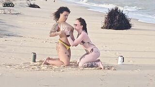 2 LESBO BEAUTIES PLAYING ON THE BEACH WERE CAUGHT BY A TOURIST AND HAD THEIR BOOTIES SCREWED