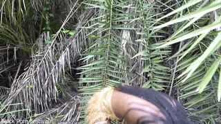 Sexy Afro native woman cooking in the jungle