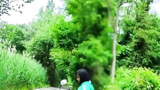 BIKER FEMALE BLACK SOLO PUBLIC MOTORCYCLE NYC OUTSIDE PARK