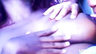 An all ebony bonobo weenie is jointly with 2 women