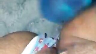 Black using sex-toy in her twat