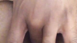 Youthful black playing with her butt