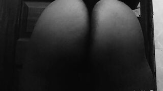 Black in a belt teasing and exposing her ass