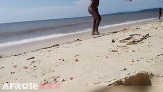Black undressed on public beach