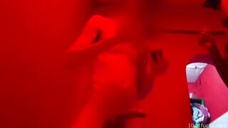 Interracial sex filmed in a dimly lit bordel