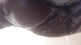 Large butt all soaped up in the shower