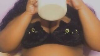 Black with an giant stomach drinking milk