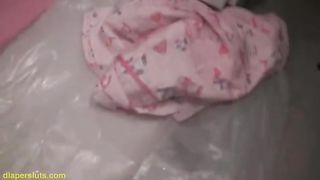 Piss; Cute black girl pisses in her diaper