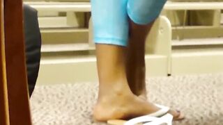 Black teen feet in library
